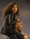 Gianna Bryant sits on the shoulders of her father, Kobe Bryant, as they attend the women's soccer match between the United States and China Thursday, April 10, 2014, in San Diego. (AP Photo/Lenny Ignelzi)