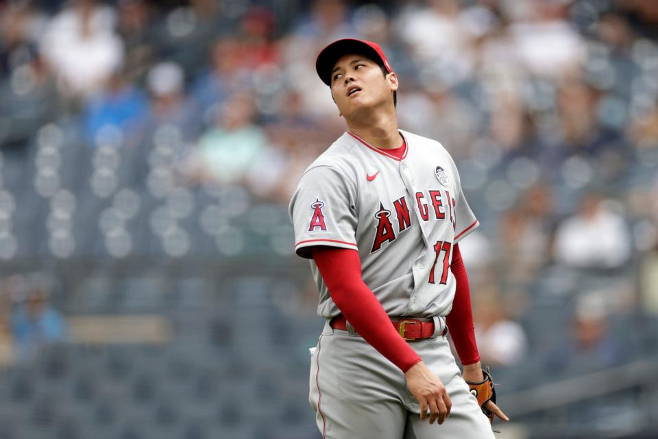 Los Angeles Angels pitcher Shohei Ohtani (17) reacts during the third inning of the first baseball game of a doubleheader against the New York Yankees on Thursday, June 2, 2022, in New York. (AP Photo/Adam Hunger)