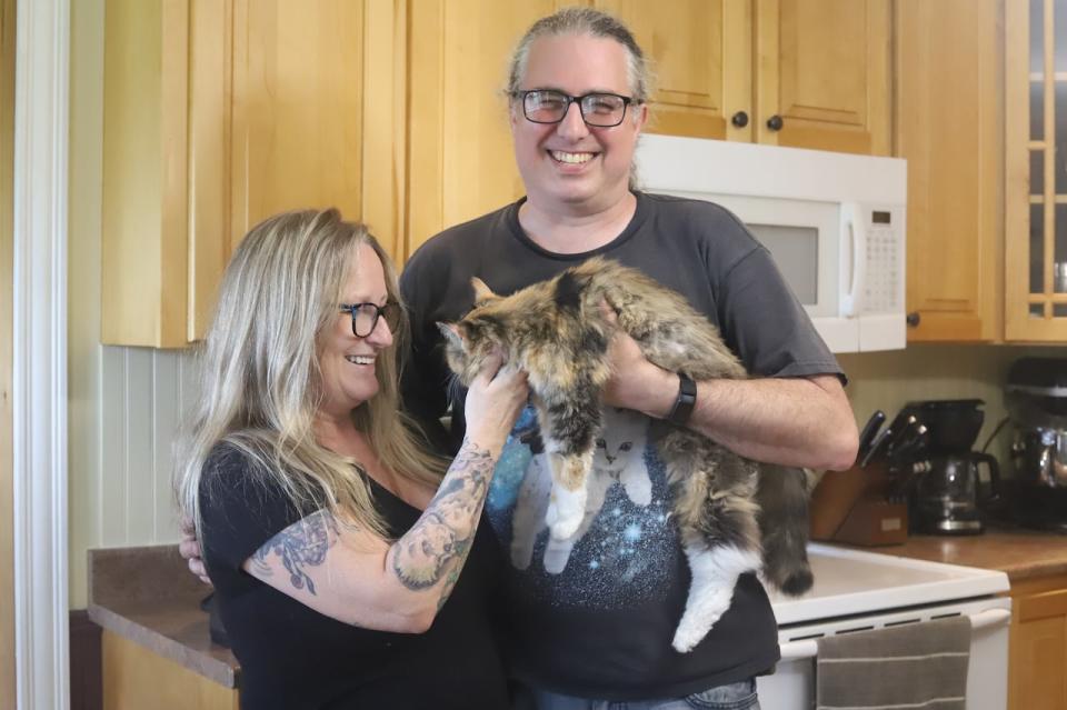 Although she can't see them, Bagel loves to be held by her owners and gets lots of love from all members of the family.