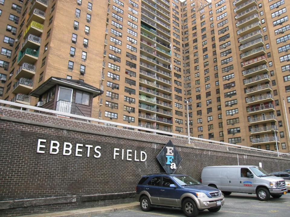 This April 7, 2013 image shows the site of the Brooklyn Dodgers’ ballpark, Ebbets Field, which was torn down after the Dodgers moved to Los Angeles in 1957 and is today an apartment complex in the Crown Heights neighborhood. A stone in the wall says “This is the former site of Ebbets Field” while a faded sign in the courtyard says “No ball playing.” A new movie, “42,” tells the inspiring story of how Jackie Robinson integrated Major League Baseball when he played here for the Dodgers, beginning in 1947. (AP Photo/Beth J. Harpaz)