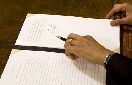 The signature of U.S. President Barack Obama is seen in this January 22, 2009 file photo after he signed an executive order about the U.S. military base and detention facility in Guantanamo Bay, Cuba on his second official day on the job as president of the United States at the White House in Washington. REUTERS/Larry Downing/Files