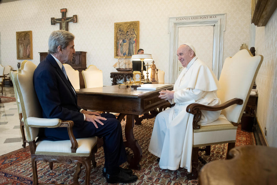 Pope Francis and John Kerry talk during their meeting at the Vatican, Saturday, May 15, 2021. Former U.S. Secretary of State John Kerry, currently President Biden’s envoy on the climate, met in private audience with Pope Francis on Saturday, afterward calling the pope “a compelling moral authority on the subject of the climate crisis” who has been “ahead of the curve.” Kerry told Vatican News in an interview that the pope speaks with “unique authority, compelling moral authority, that hopefull can push people to greater ambition to get the job done. (Vatican Media via AP)