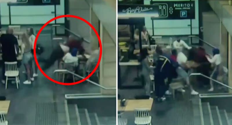 The alleged attacker leans over the table to reach the woman (left) before bystanders try to restrain him. Source: 9News