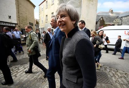 Britain's Prime Minister Theresa May walks during a campaign stop in Mevagissey, Cornwall, May 2, 2017. REUTERS/Dylan Martinez