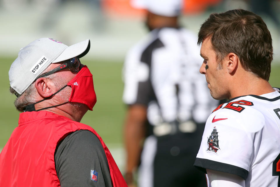 Bucs Head coach Bruce Arians talks with quarterback Tom Brady (12) before the regular season game between the Green Bay Packers and the Tampa Bay Buccaneers on October 18, 2020 at Raymond James Stadium in Tampa, Florida. (Photo by Cliff Welch/Icon Sportswire via Getty Images)