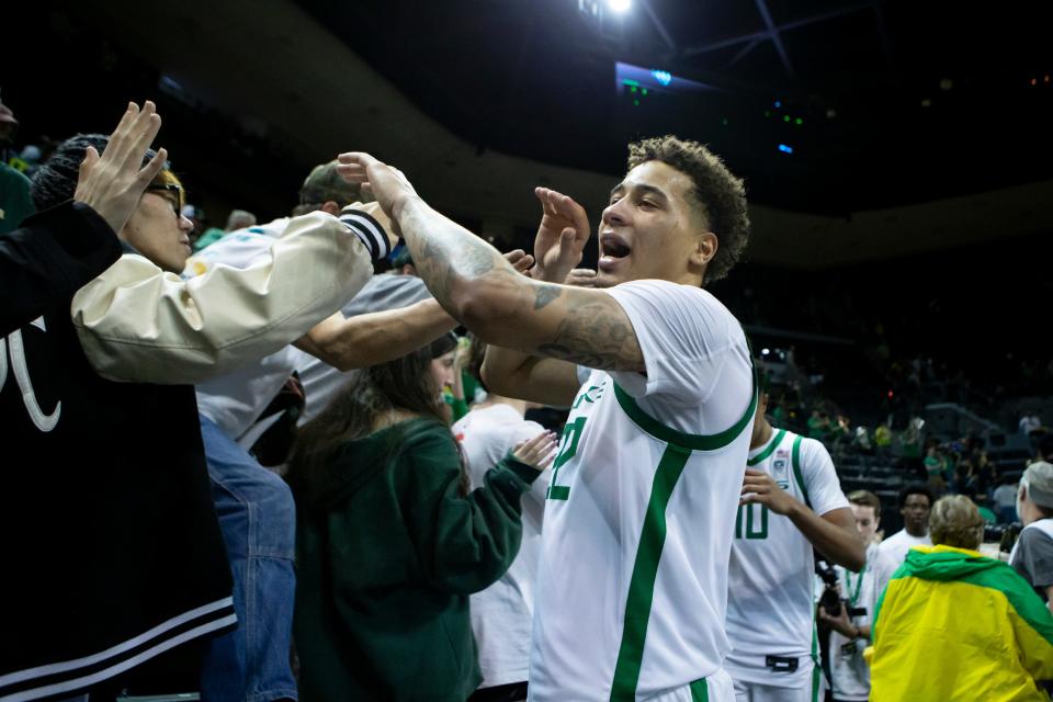 Oregon guard Jadrian Tracey celebrates with fans after the Ducks’ win as the Oregon Ducks host the UCLA Bruins Saturday, Dec. 30, 2023, at Matthew Knight Arena in Eugene, Ore.