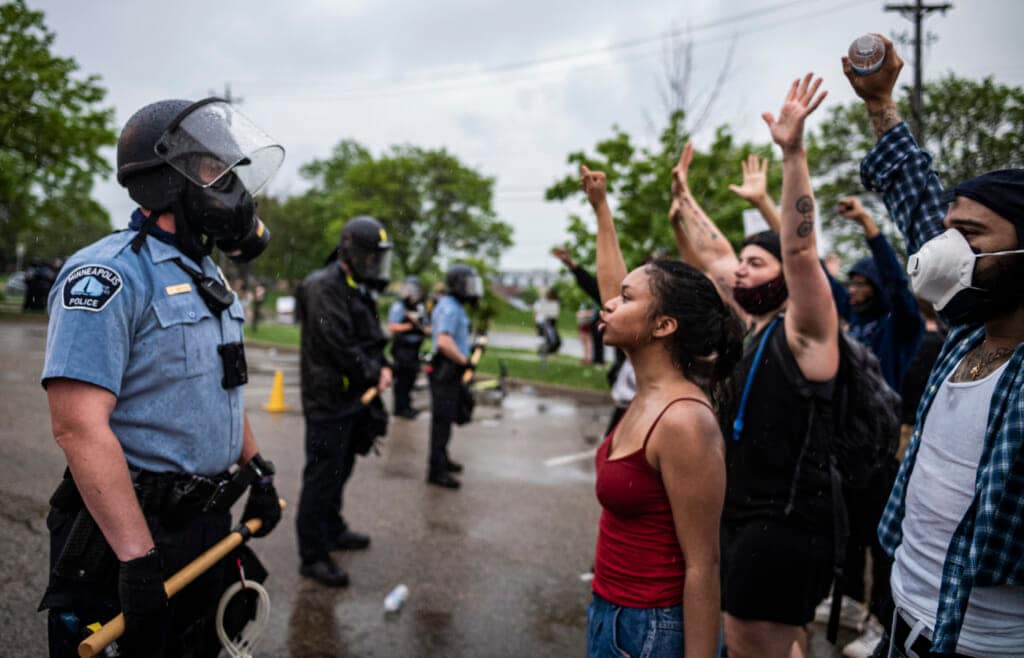 Protesters and police face each other during a rally for George Floyd in Minneapolis on May 26, 2020. Almost two years after George Floyd died at the hands of four Minneapolis police officers, Minnesota’s Department of Human Rights was set Wednesday, April 27, 2022, to announce findings from its investigation into whether the city police department had a pattern or practice of racial discrimination in policing. (Richard Tsong-Taatarii/Star Tribune via AP)