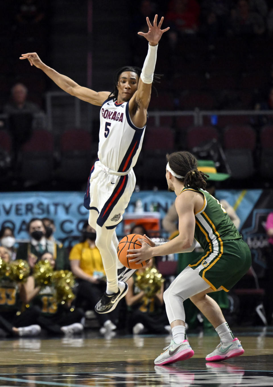 Gonzaga guard Hunter Sallis (5) defends against San Francisco guard Tyrell Roberts during the second half of an NCAA college basketball game in the semifinals of the West Coast Conference men's tournament Monday, March 6, 2023, in Las Vegas. (AP Photo/David Becker)