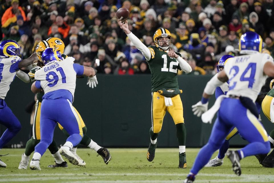 Green Bay Packers' Aaron Rodgers thorws a pass during the first half of an NFL football game against the Los Angeles Rams Sunday, Nov. 28, 2021, in Green Bay, Wis. (AP Photo/Morry Gash)