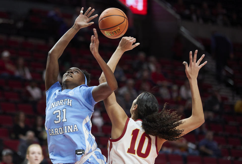 North Carolina forward Anya Poole, left, has a shot blocked by Iowa State center Stephanie Soares during the first half of an NCAA college basketball game in the Phil Knight Invitational in Portland, Ore., Sunday, Nov. 27, 2022. (AP Photo/Craig Mitchelldyer)