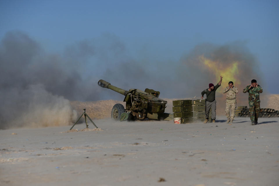 <p>Popular Mobilization Forces (PMF) fire toward Islamic State militants during a battle with Islamic State militants, west of Mosul, Iraq, Feb. 20, 2017. (Stringer/Reuters) </p>