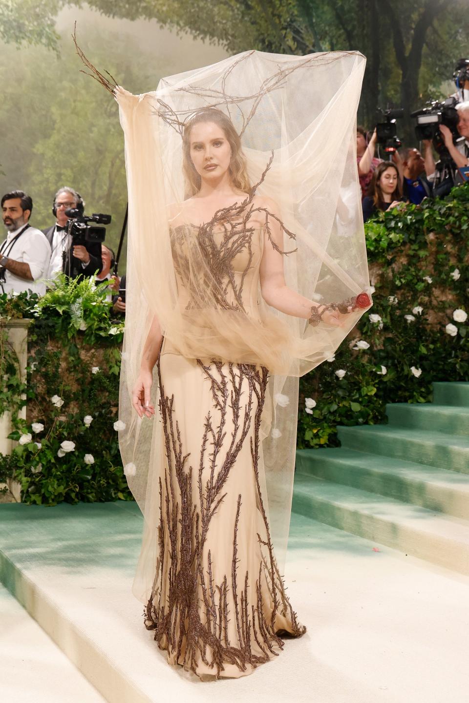 Wearing custom Alexander McQueen, Lana Del Rey was literally covered in branches — in the most couture way possible. Did you want a garden?