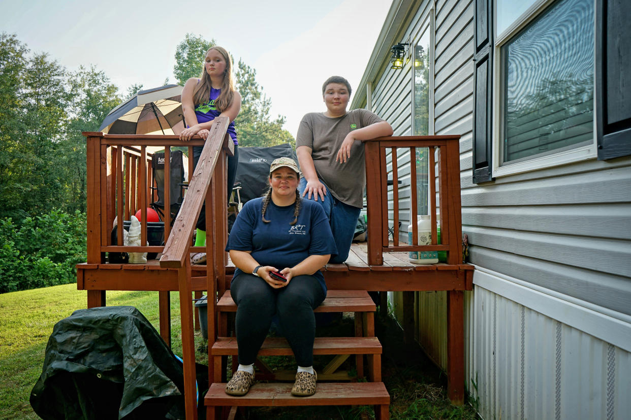 Becky Brown with her two children at her home in Red Banks, Miss.        (Vanessa Charlot for NBC News)