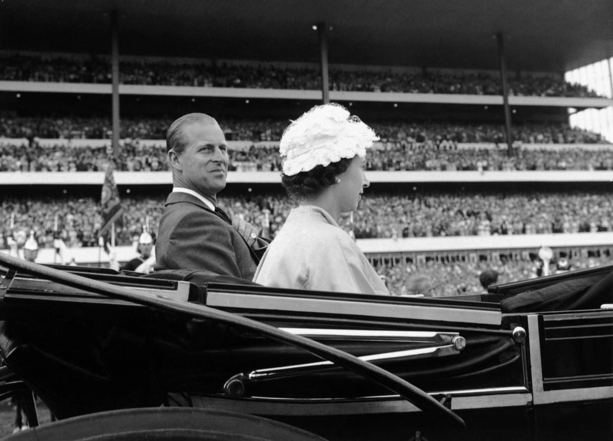 Her Majesty Queen Elizabeth II and her husband Prince Philip, Duke of Edinburgh, arrive in a carriage to attend the opening ceremonies of the 100th running of the Queen's Plate
