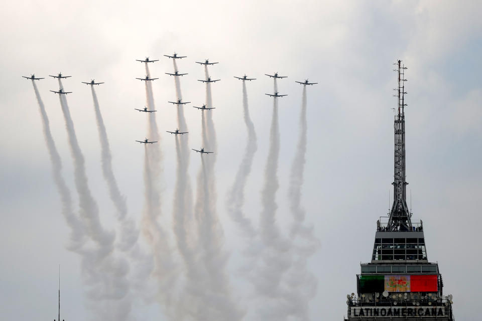 VARIOUS CITIES, MEXICO - SEPTEMBER 16: Mexican Air Force aircrafts perform a ceremonial flight during the Independence Day military parade at Zocalo Square on September 16, 2020 in Various Cities, Mexico. This year El Zocalo remains closed for general public due to coronavirus restrictions. Every September 16 Mexico celebrates the beginning of the revolution uprising of 1810. (Photo by Hector Vivas/Getty Images)