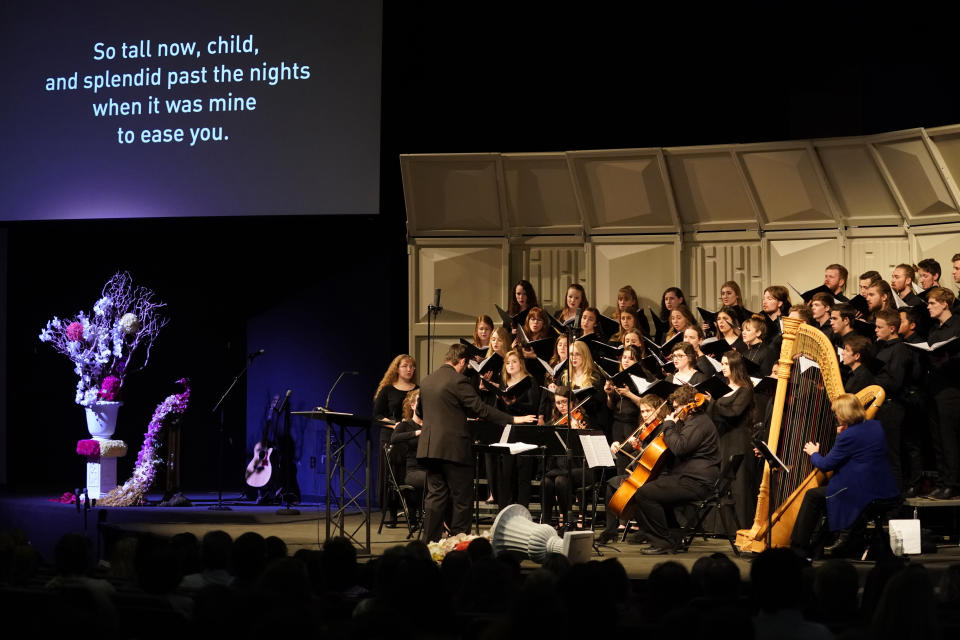 The Colorado Christian University choir performs at a faith-based memorial service for the victims of the massacre at Columbine High School nearly 20 years earlier, at a community church, Thursday, April 18, 2019, in Littleton, Colo. (Rick Wilking/Pool Photo via AP)