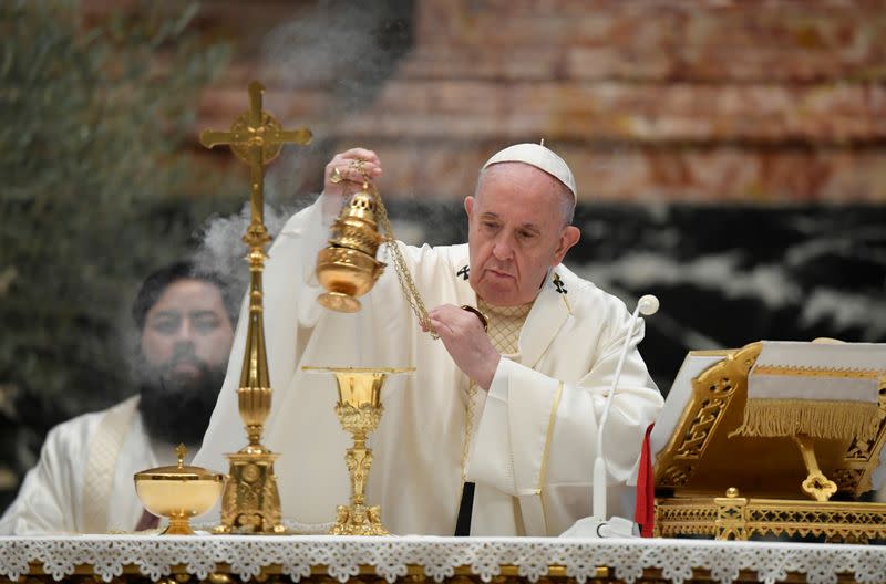 Pope Francis holds a Mass on Holy Thursday at the Vatican