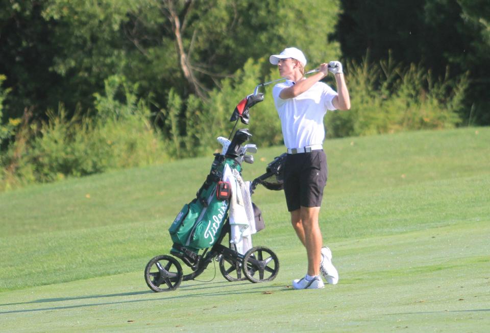 Newark Catholic's Nathan Riggleman watches his approach shot on No. 17 during the first LCL tournament Aug. 9 at Virtues.