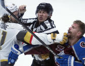 Linesman Mark Shewchyk (92) tries to break up a fight between Vegas Golden Knights right wing Mark Stone (61) and Colorado Avalanche right wing Joonas Donskoi (72) in the third period of Game 1 of an NHL hockey Stanley Cup second-round playoff series Sunday, May 30, 2021, in Denver. (AP Photo/Jack Dempsey)