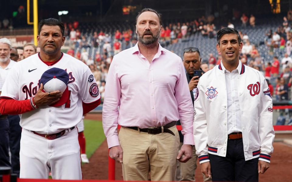 Mr Sunak joined Dave Martinez, the Nationals coach, and Stuart Taylor, a British Army veteran, for the anthems - REUTERS