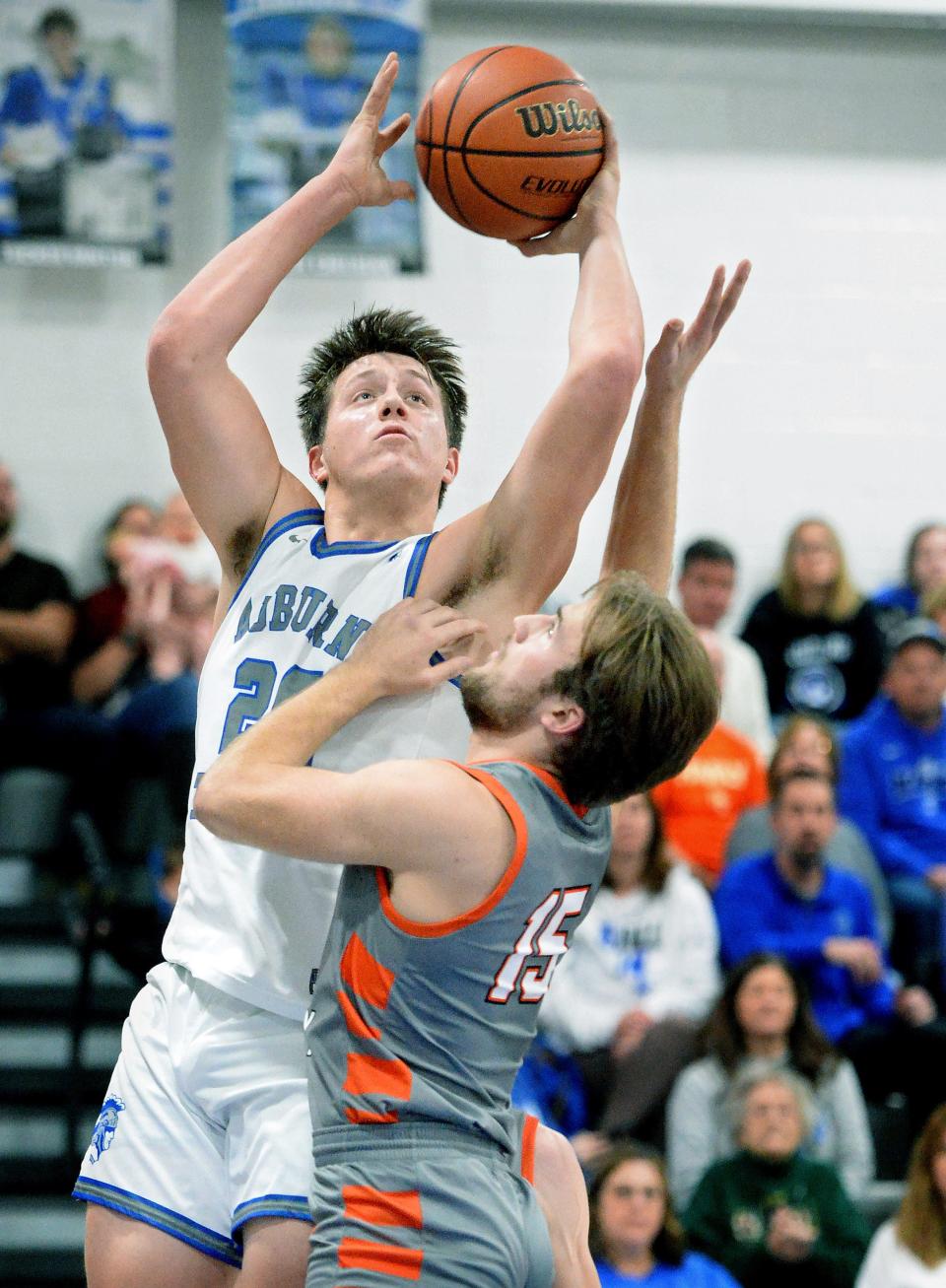 Auburn's Grant Dobson shoots the ball wile being guarded by South County's Clark Nelson during the game Friday, January 5, 2024.