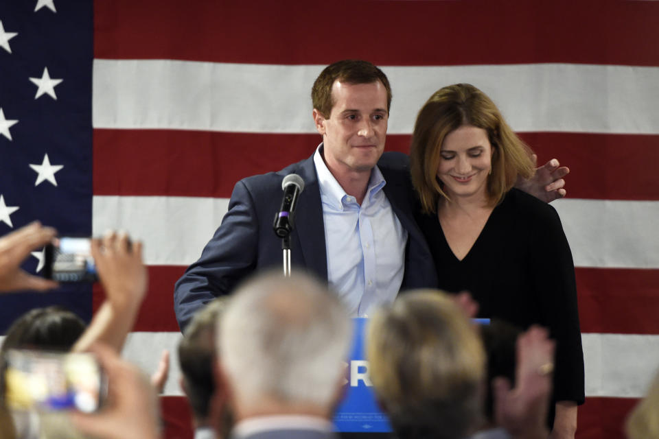 With his wife, Laura by his side, Democrat Dan McCready greets supporters after losing a special election for United States Congress in North Carolina's 9th Congressional District to Republican, Dan Bishop, Tuesday, Sept. 10, 2019, in Charlotte, N.C. (AP Photo/Kathy Kmonicek)