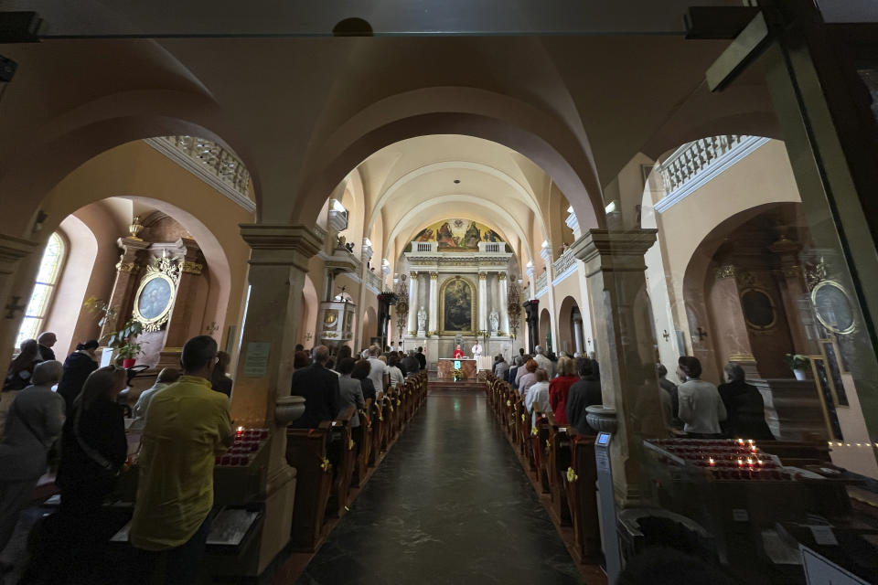 Churchgoers attend a mass at St Francis Xavier Cathedral, in Banska Bystrica, central Slovakia, Sunday, May 19, 2024. Slovakia's populist prime minister, Robert Fico, remained in serious condition on Sunday but has been given a positive prognosis four days after he was shot multiple times in an assassination attempt that has sent shockwaves across the deeply polarized European Union nation, the defense minister Rober Kalinak said. (AP Photo/Lefteris Pitarakis)