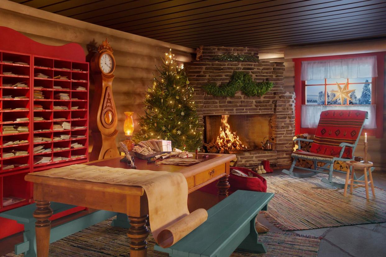 a living room with a fireplace and a tree