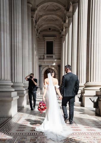 <p>Aisha Cole</p> Jerome Cole photographing bride and groom