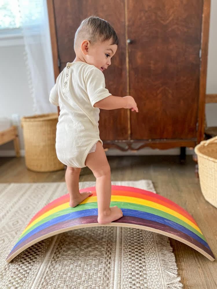 <p><strong>Bunny Hopkins</strong></p><p>bunnyhopkinstoys.com</p><p><strong>$129.00</strong></p><p>It's just one little arc, but it can be used in so many ways: as a ramp to crawl over, a U-shape to balance on or even as a slide off the couch! No matter how it's used, it <strong>gets kids to work on their gross motor coordination and balance</strong>. It comes in two sizes (one for toddlers and one for preschoolers), and also in a range of finishes, including natural wood. You can also get matching <a href="https://bunnyhopkinstoys.com/collections/stepping-stones-collection/products/stepping-stones-rainbow" rel="nofollow noopener" target="_blank" data-ylk="slk:stepping stones;elm:context_link;itc:0;sec:content-canvas" class="link ">stepping stones</a>. <em>Ages 18 months+</em></p>