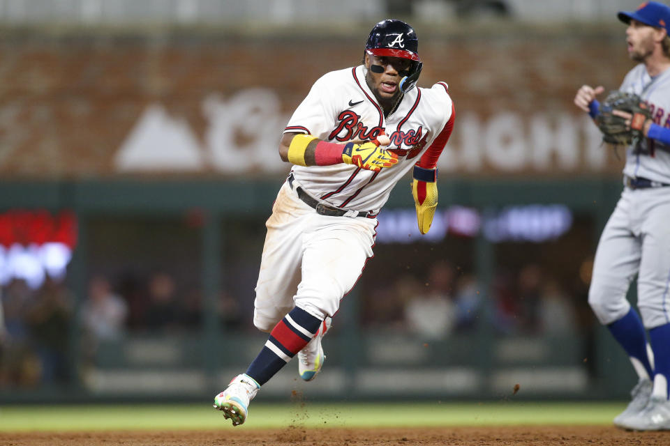 Atlanta Braves' Ronald Acuna Jr. runs to third during the third inning of the team's baseball game against the New York Mets, Saturday, Oct. 1, 2022, in Atlanta. (AP Photo/Brett Davis)