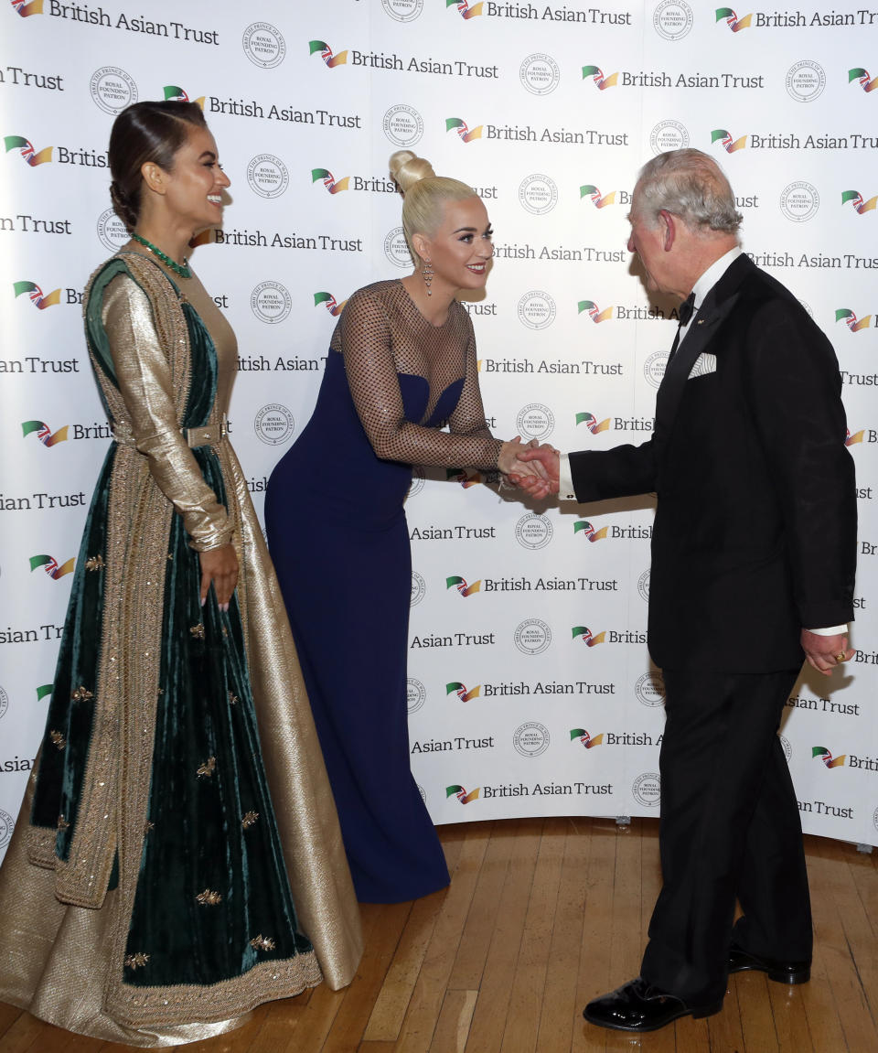 LONDON, UNITED KINGDOM - FEBRUARY 04: Prince Charles, Prince of Wales, Royal Founding Patron of the British Asian Trust meets American musician Katy Perry and Indian businesswoman Natasha Poonawalla (L) as they arrive to attend a reception for supporters of the British Asian Trust on February 4, 2020 in London, England. (Photo by Kirsty Wigglesworth - WPA Pool/ Getty Images)