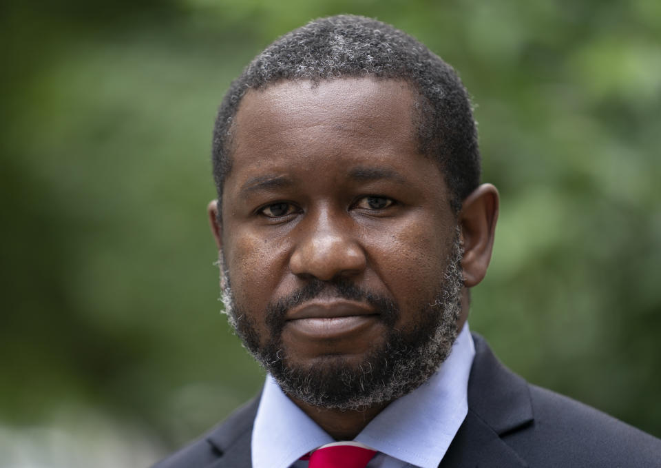 Economist Gbenga Ajilore poses for a photo outside his home in Washington, Friday, June 19, 2020. Ajilore believes the coronavirus pandemic is affecting the two largest U.S. generations, Baby Boomers and Millennials. For baby boomers, named for the post-World War II surge of births, that means those who retired or are nearing retirement age are seeing their retirement accounts appearing unreliable while their health is at high risk. Millennials, who became young adults in this century, are getting socked again as they were still recovering from the Great Recession. (AP Photo/J. Scott Applewhite)