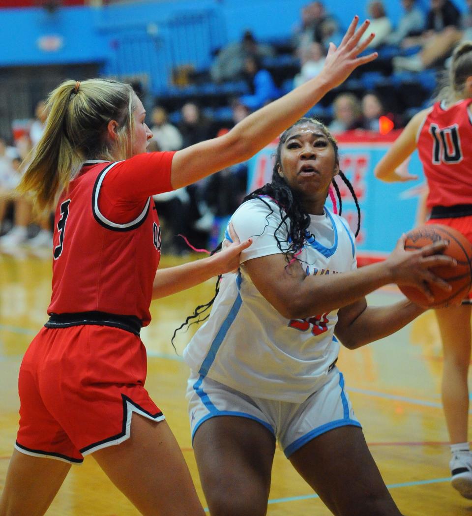 Alliance's X'Zaryia Fannin looks to shoot as Salem's Kami Rohm defends in an Eastern Buckeye Conference game at Alliance High School Wednesday, November 30, 2022.