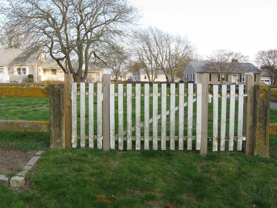 The gate to Clark's Point Cemetery stands on the north side of the property.