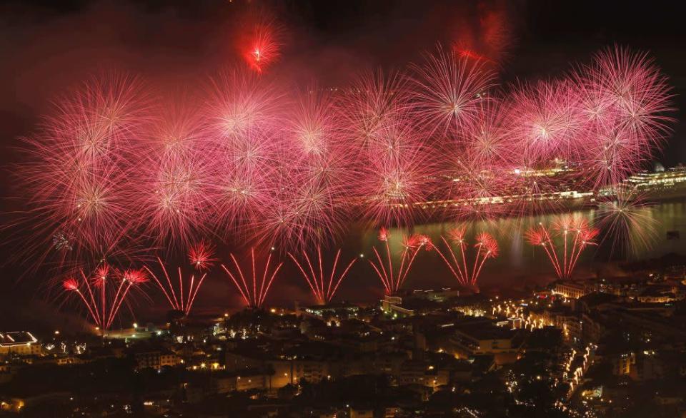 Fireworks explode over the Funchal city bay during New Year celebrations in Madeira island January 1, 2013.