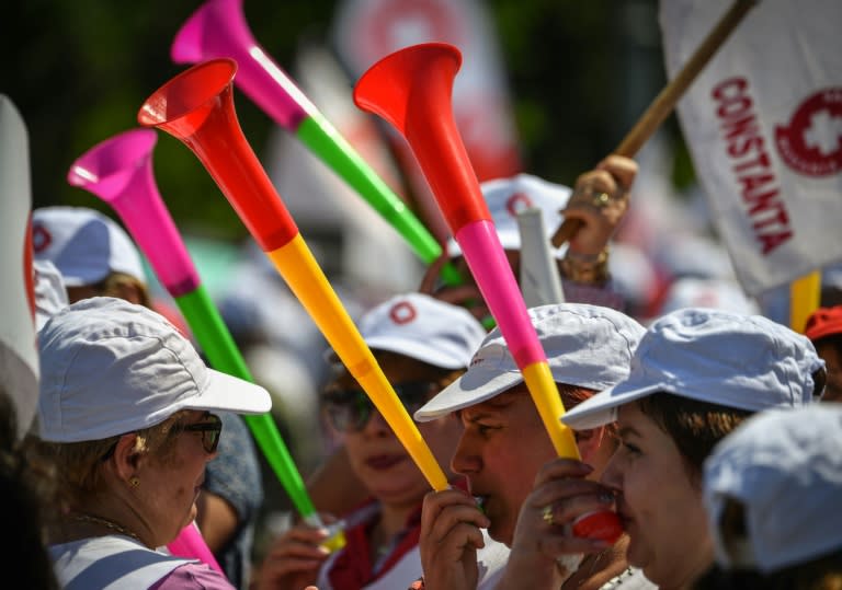 The protesters included nurses, physiotherapists and biochemists who gathered in front of the Romanian government's headquarters in the central Victory Square