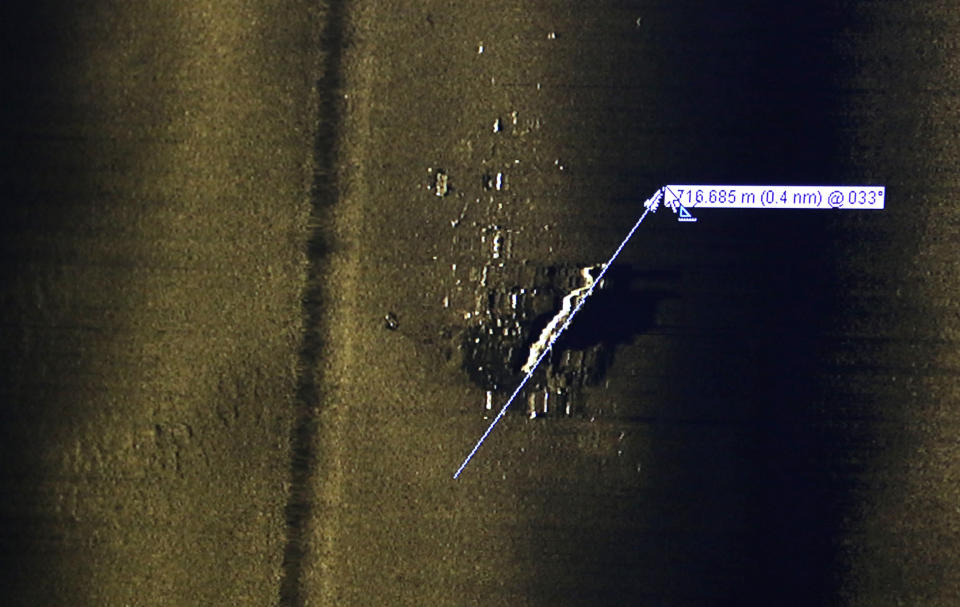 Rob Kraft, director of undersea operations at Vulcan Inc., reviews sonar scans of a warship from the World War II Battle of Midway that was found by the crew of the research vessel Petrel, Sunday, Oct. 20, 2019, off Midway Atoll in the Northwestern Hawaiian Islands. (AP Photo/Caleb Jones)