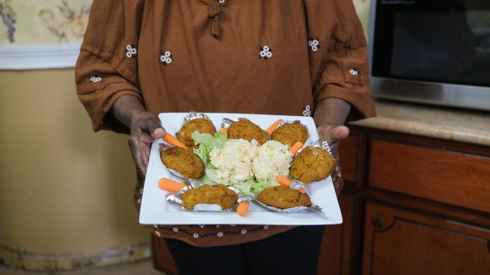 Teresa Weston holding her deviled crabs and egg salad, at Second African Baptist Church, on February 17th, 2024.