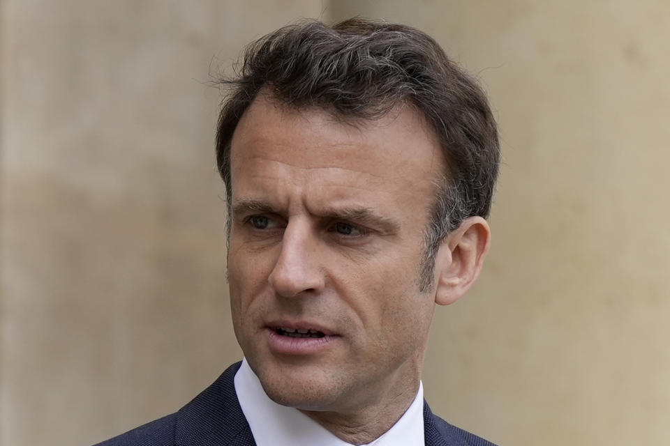 FILE - French President Emmanuel Macron looks on as he talks with Senegalese war veterans Friday, April 14, 2023 at the Elysee Palace in Paris. French President Emmanuel Macron is aiming to calm public anger that threatens the ambitions of his remaining four years in power with a first televised address to the nation on Monday April 17, 2023 since he enacted protest-igniting pension reforms. (AP Photo/Lewis Joly, Pool, File)