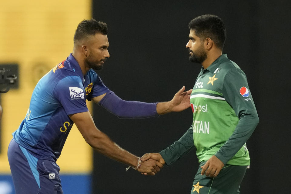 Sri Lankan captain Dasun Shanaka shakes hands with Pakistan's captain Babar Azam after their two wickets win in the Asia Cup cricket match between Pakistan and Sri Lanka in Colombo, Sri Lanka on Thursday, Sept.14, 2023. (AP Photo/Eranga Jayawardena)