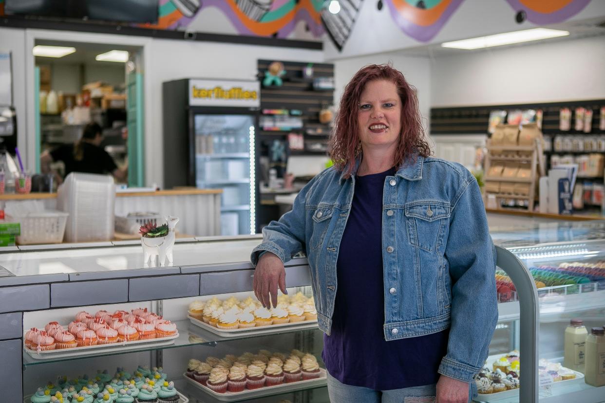 Kari Garcia, Regional Manager at High Five Cakes and Rainbow Boba in Circleville, Waverly and Chillicothe, stands in front of the display counter inside High Five Cakes  in Chillicothe.