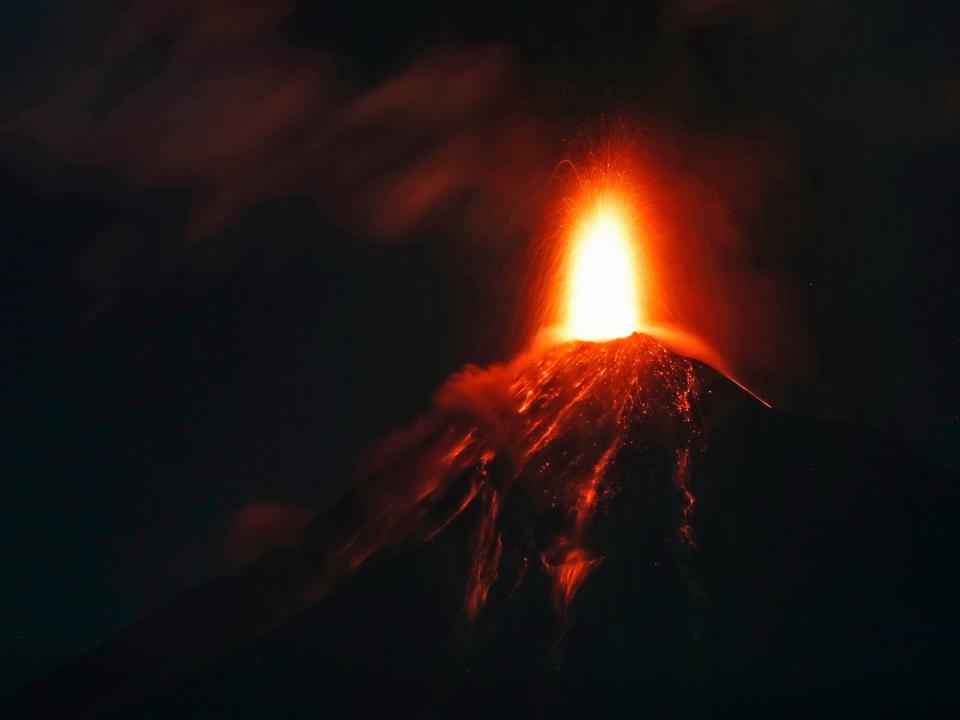 The Volcano of Fire spews hot molten lava from its crater in Antigua, Guatemala, early on Monday, 19 November: AP