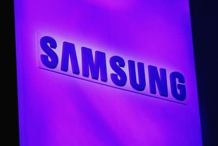 The company logo is displayed at the Samsung news conference at the Consumer Electronics Show (CES) in Las Vegas January 7, 2013. REUTERS/Rick Wilking