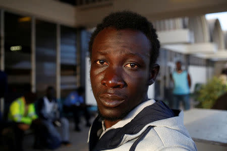 Mafu Hydara, a Gambian migrant who voluntarily returned from Libya, looks on as he waits for registration at the airport in Banjul, Gambia April 4, 2017. REUTERS/Luc Gnago