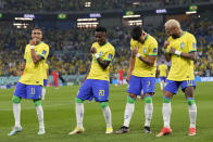 Brazil's Vinicius Junior, 2nd left, celebrates after scoring his side's opening goal during the World Cup round of 16 soccer match between Brazil and South Korea at the Stadium 974 in Doha, Qatar, Monday, Dec. 5, 2022. Left to right, Raphinha, Vinicius Junior, Lucas Paqueta, Neymar. (AP Photo/Jin-Man Lee)