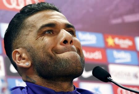 Barcelona's Dani Alves gestures during a news conference after a training session at the Barcelona training grounds Ciutat Esportiva Joan Gamper in Sant Joan Despi near Barcelona, Spain, May 25, 2015. REUTERS/Gustau Nacarino