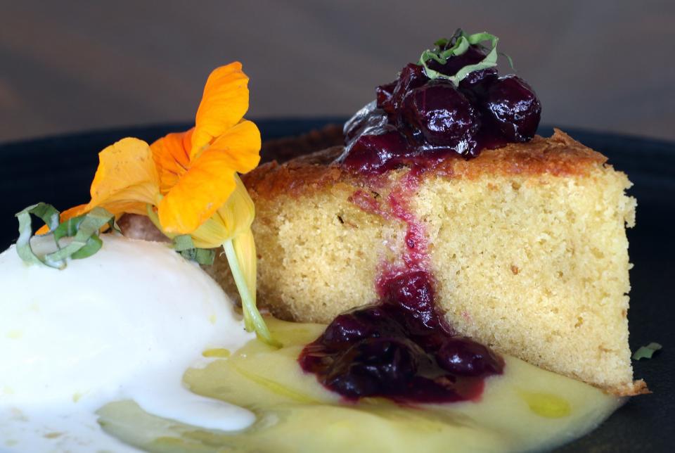 Vanda Cucina serves elegant dishes by chef Gina Pezza inspired by a beloved mother's kitchen. Olive Oil Cake is a rustic but delicious way to end a meal. It's served with lemon curd, a seasonal berry compote and vanilla gelato.