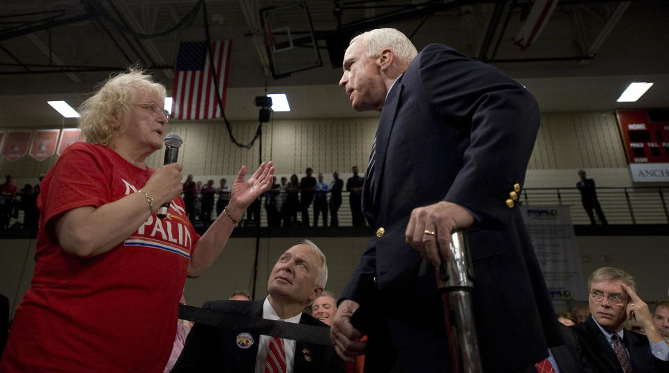 Sen. John McCain listens to supporter who called Democratic presidential candidate Barack Obama an “Arab” during a town hall meeting in Lakeville, Minn., in October 2008. (Photo: Jim Watson/AFP/Getty Images)