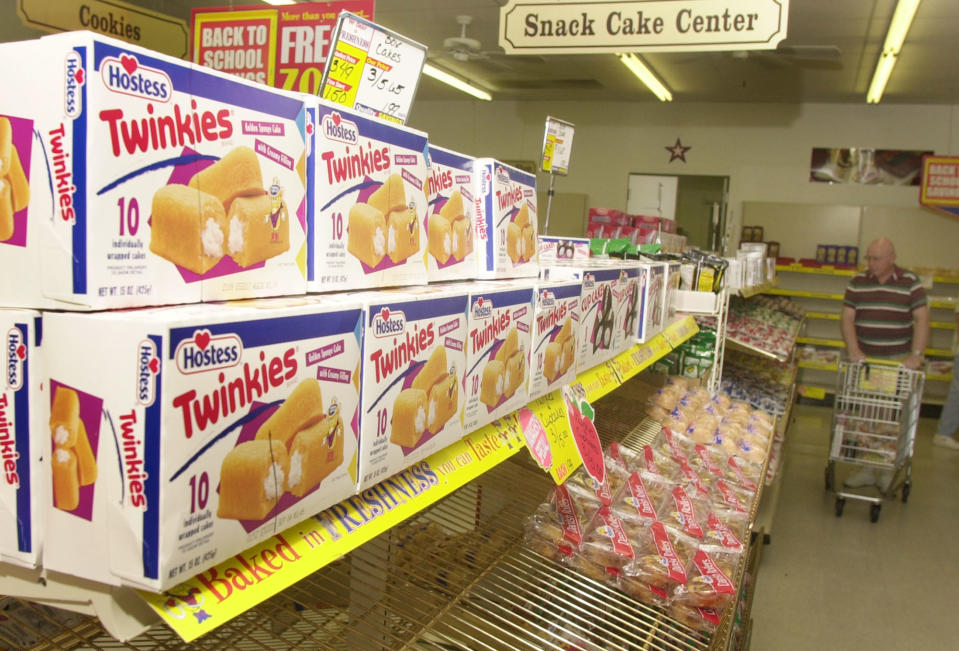 Twinkies await sale on a shelf in a Wonder Bread Outlet store Tuesday, Aug. 19, 2003, in Lawrence, Kan.  More than 70 years after the debut of the world famous Hostess Twinkie, the current baker of the treats is struggling as competitors including Krispy Kreme Doughnuts Inc. eat away  at the baked goods industry profits. (AP Photo/Orlin Wagner)